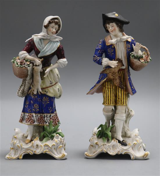 A pair of German porcelain figures H.21.5cm